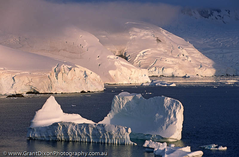 image of Lemaire icebergs at sunset