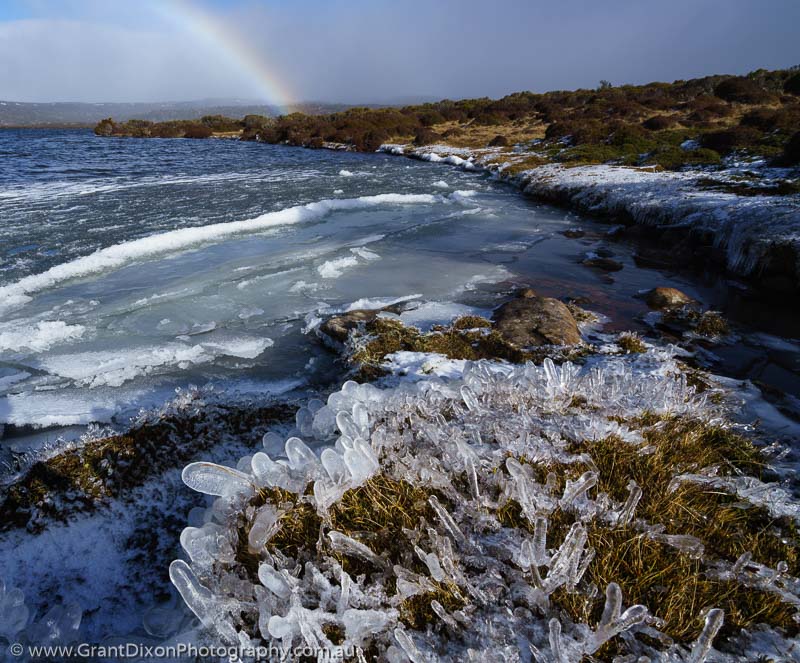 image of Lakeshore ice and rainbow