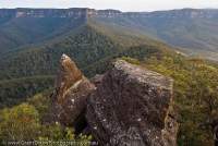 AUSTRALIA, NSW, Katoomba, Blue Mountains National Park. Weathered sandstone outcrop on Koorowall Knife Edge, cliffs of Narrowneck beyond, Greater Blue Mountains World Heritage Area.