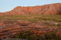 AUSTRALIA, Western Australia, East Kimberley, Purnululu National Park (Bungle Bungles).  Layered sandstone domes beside Piccanniny Creek, sunrise.