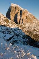 AUSTRALIA, Tasmania, Franklin-Gordon Wild Rivers National Park. Dawn light on 400m quartzite southeast face of Frenchmans Cap, winter. In summer this face is a challenge to rock-climbers.