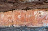 AUSTRALIA, Western Australia, West Kimberley.  Wandjina (creator beings), rock art style painted during last 4000 years.