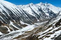 NEPAL, Dolpo. Snowdrifts in remote Swaksa Khola valley.