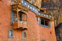 NEPAL, Dolpo. Part of Tsakang Buddhist monastery complex, built into cliffs above high Tartang Khola River, near Shey Gompa.