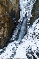 NEPAL, Dolpo. Part-frozen waterfall below Nagdala La (Kang La, 5300m).
