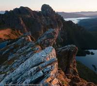 AUSTRALIA, Tasmania, Southwest National Park. Quartzite strata, Federation Peak beyond, dawn.