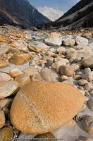 INDIA, Uttaranchal, Gangotri. Polished boulders beside Bhagirarthi River, main tributory of the Ganges.