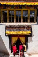 Buddhist monks entering temple within Hemis Gompa, spiritual centre for Ladakh's Drukpa Buddhists, founded in 1630.