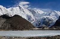 NEPAL. Cho Oyu (8153m), rising beyond part-frozen Gyazumba Tsho (6th lake), Gokyo (Dudh Khosi) valley, Sagamartha National Park.