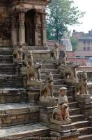 NEPAL. Bhaktapur, Kathmandu valley. Stone guardians flanking stairway at 17th century Siddhi Lakshmi Temple, Durbar Square.