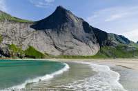 NORWAY, Nordland. Lofoten Islands, Moskenesoy. Glaciated granite cliff face on Helvetestinden, Bunes beach.