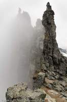 NORWAY, Northern fjords, Trolltindene. Pinnacles in mist at top of Trollveggen (Troll Wall), Trollryggen.