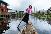 Boat woman at lakeside village, Inle Lake