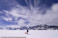 ARGENTINA, Patagonia. Skiing with sled on the southern Patagonian icecap.