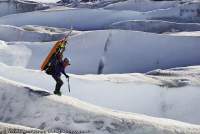ARGENTINA, Patagonia. A delicate traverse, fully laden with equipment, in crevassed terrain on lower Upsala Glacier.