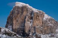 AUSTRALIA, Tasmania, Franklin-Gordon Wild Rivers National Park. Dawn light on 400m quartzite southeast face of Frenchmans Cap, winter. In summer this face is a challenge to rock-climbers.