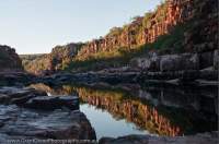 AUSTRALIA, Western Australia, West Kimberley. Charnley River. Sunset reflections in sandstone gorge