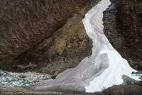 NEPAL, Dolpo. Remnant winter avalanche snow fan below Chyarga La.