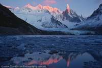ARGENTINA, Patagonia, Parque Nacional Los Glaciares. Dawn on granite peaks of Cerro Torre, from Lago Torre.