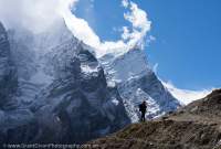 Trekker below peaks, Manaslu Circuit trek, Nepal
