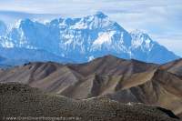 NEPAL. Nilgiri (7016m) rises beyond barren, dry landscape on north side (rain shadow) of Himalaya Range, Mustang.