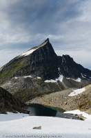 NORWAY, Northern fjords, Sunnmore Alps. Slogen (1564m) beyond glacial pool.