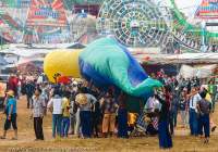 Inflating animal balloon at 2014 fire (hot air) balloon festival in Taunggyi, part of full-moon celebrations during Tazaungmon (Tazaungdaing).