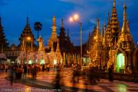 Worshippers circling Shwedagon Paya (pagoda), one of Buddhism's most sacred sites, at dusk.